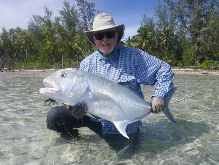 91 cm GT caught in Farquhar Atoll on an all Black EP Peanut Bunker style fly tied with Steve Farrar's Bleeding Black flash blend on 8/0 SL12 hook. One cast latter I caught a smaller 69 cm GT on the same fly.