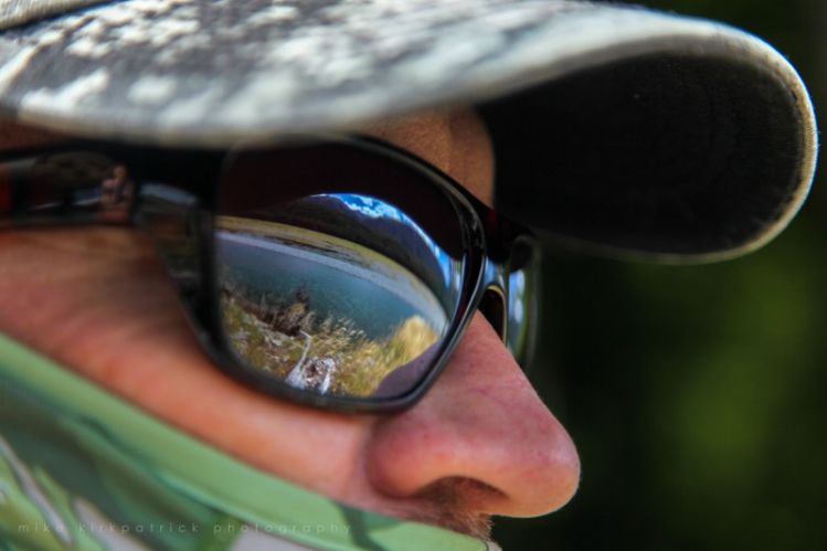 An angler, alone in his thoughts, scans a wilderness river looking for signs of life...