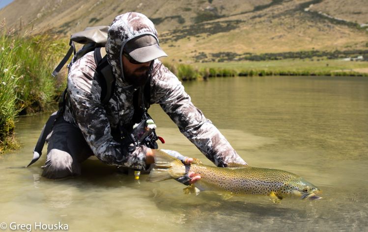 Ben West releases a big brown trout